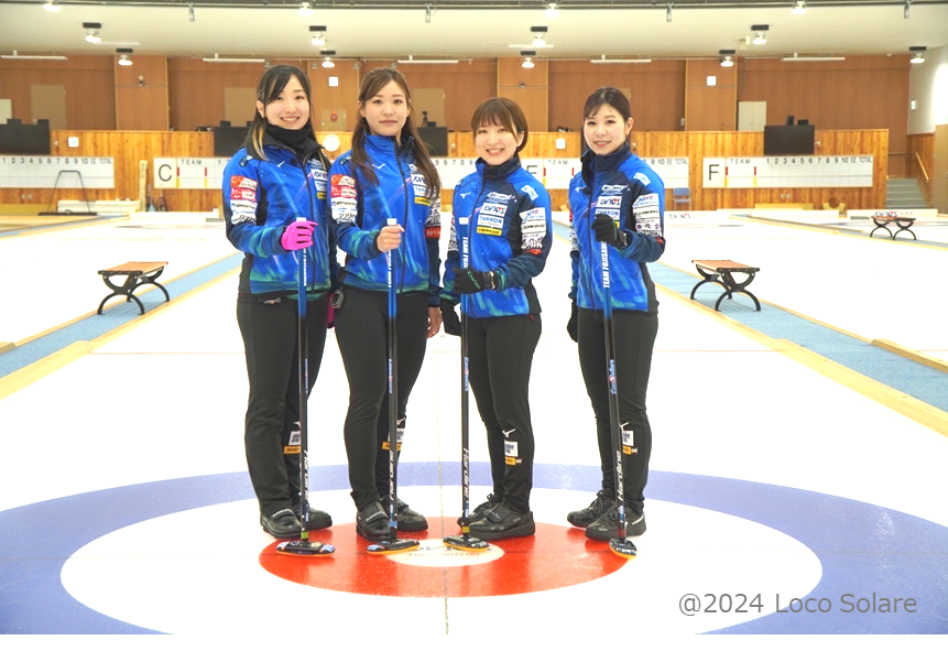 Photo of four members of the curling team